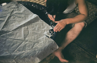 A woman at a pearl table